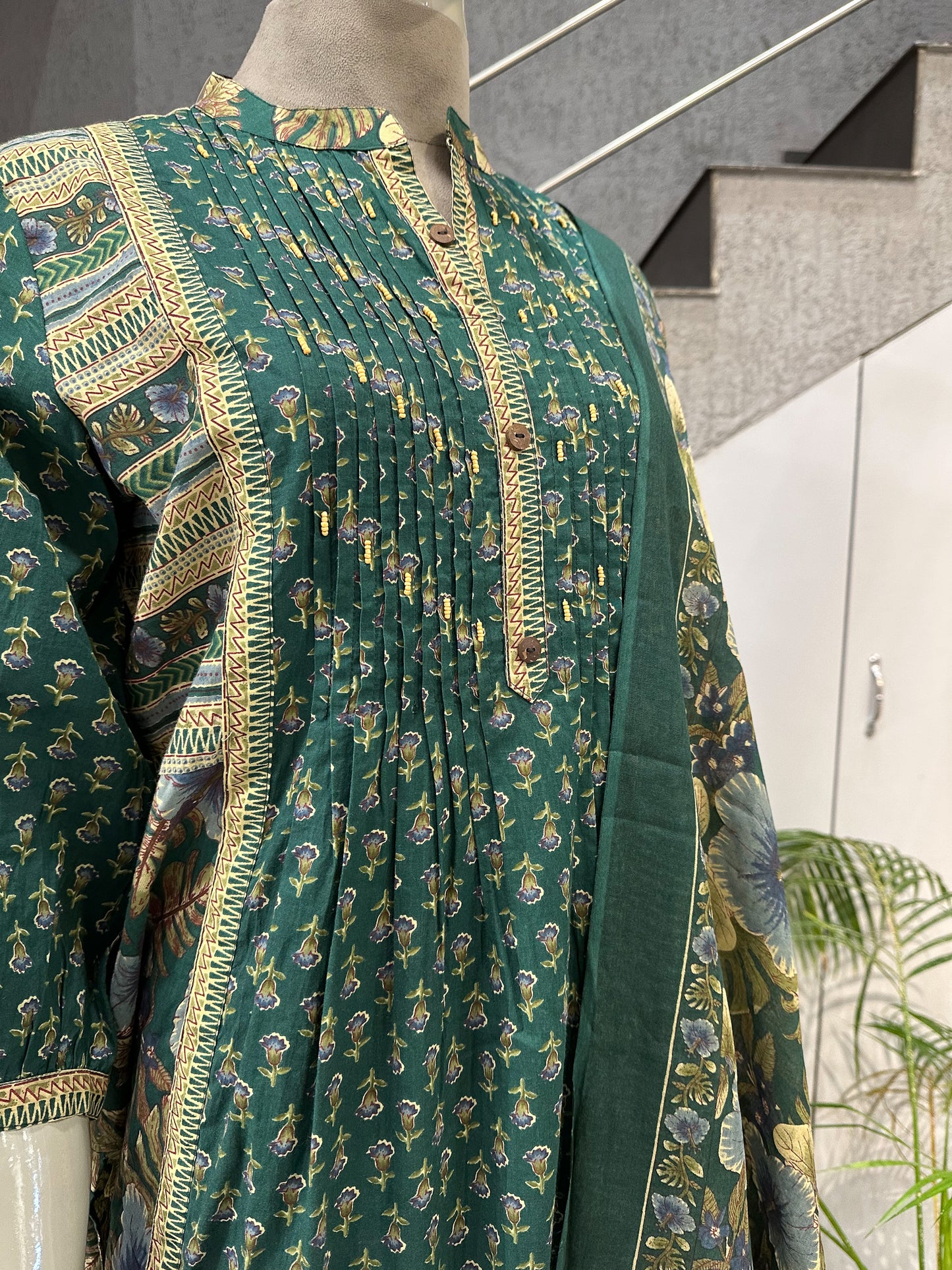 Elegant Green Cotton Churidar Set with Floral Dupatta & Pintuck Kurta Design